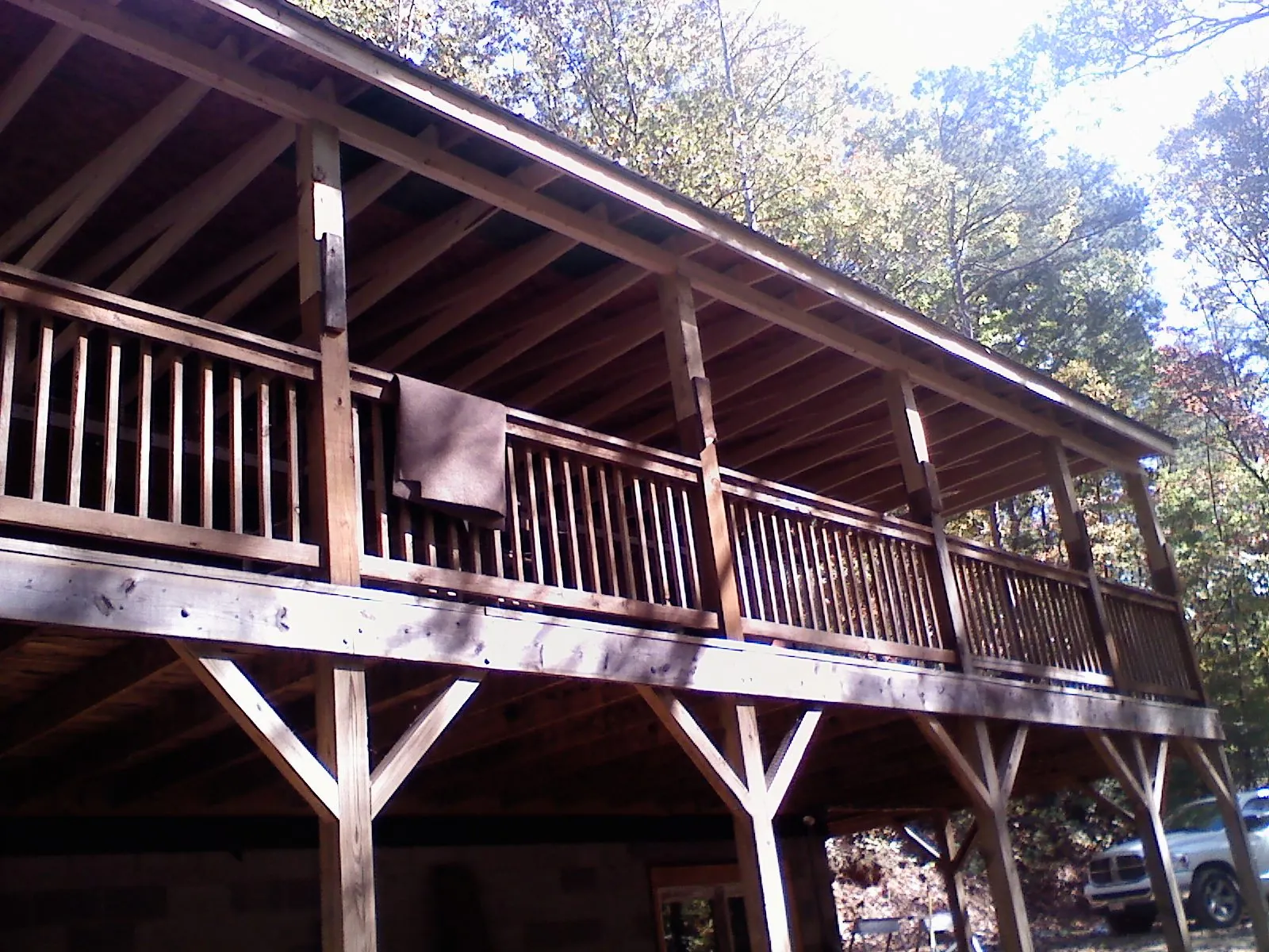 Timber framing under a new elevated porch and deck — Roof Leak Repair in Brevard by Roofing Brothers